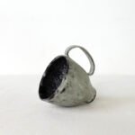 hand-built-black-clay-cup-high-footed-wabi-sabi-mug