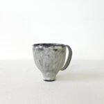 hand-built-black-clay-cup-high-footed-wabi-sabi-mug