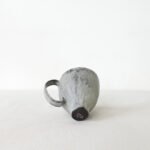 hand-built-black-clay-cup-high-footed-wabi-sabi-mug