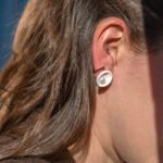 Handmade concave porcelain stud earrings with broken edges and a freshwater pearl center