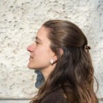 Handmade concave porcelain stud earrings with broken edges and a freshwater pearl center