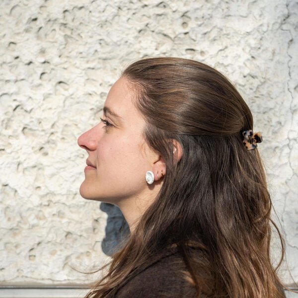 Handmade concave porcelain stud earrings with broken edges and a freshwater pearl center